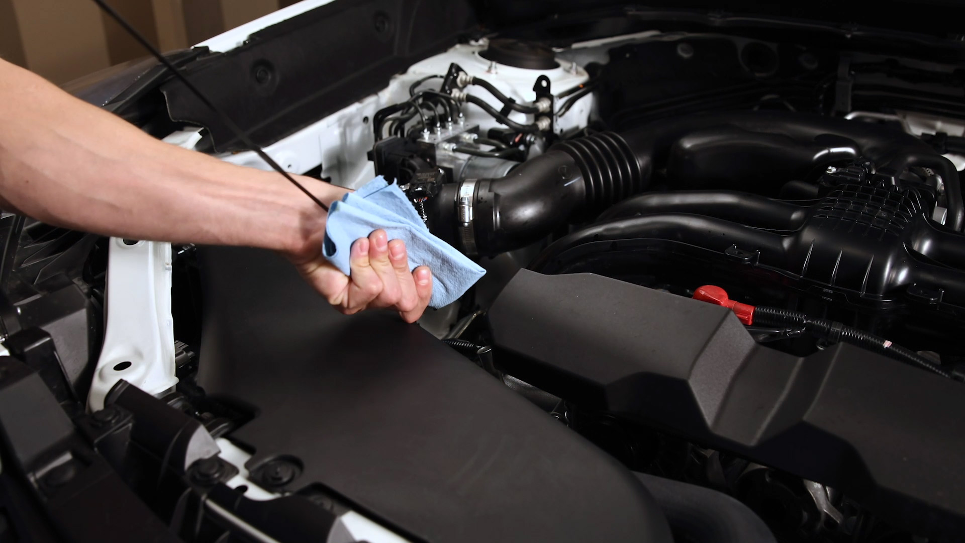 Subaru owner checking the oil on his Subaru